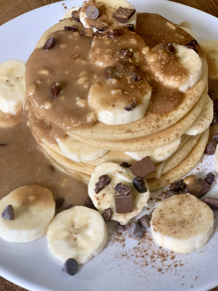 Close-up of Chocolate Peanut Butter Banana Protein Pancakes. 